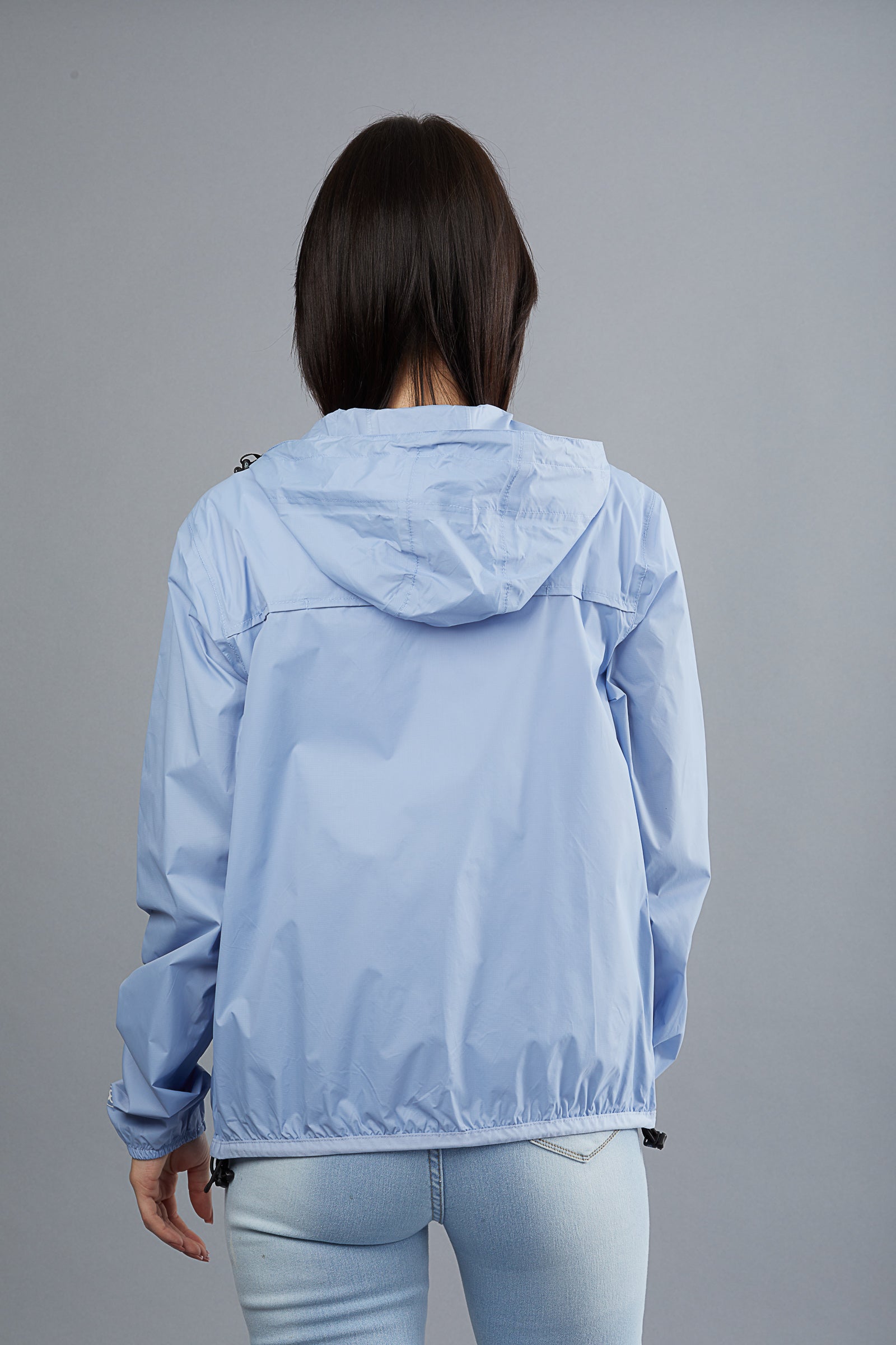 Powder blue full zip packable rain jacket and windbreaker