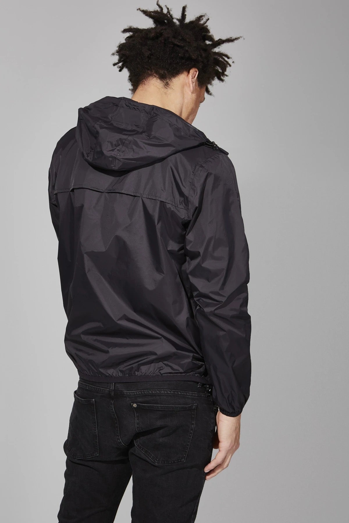 Black full zip packable rain jacket and windbreaker