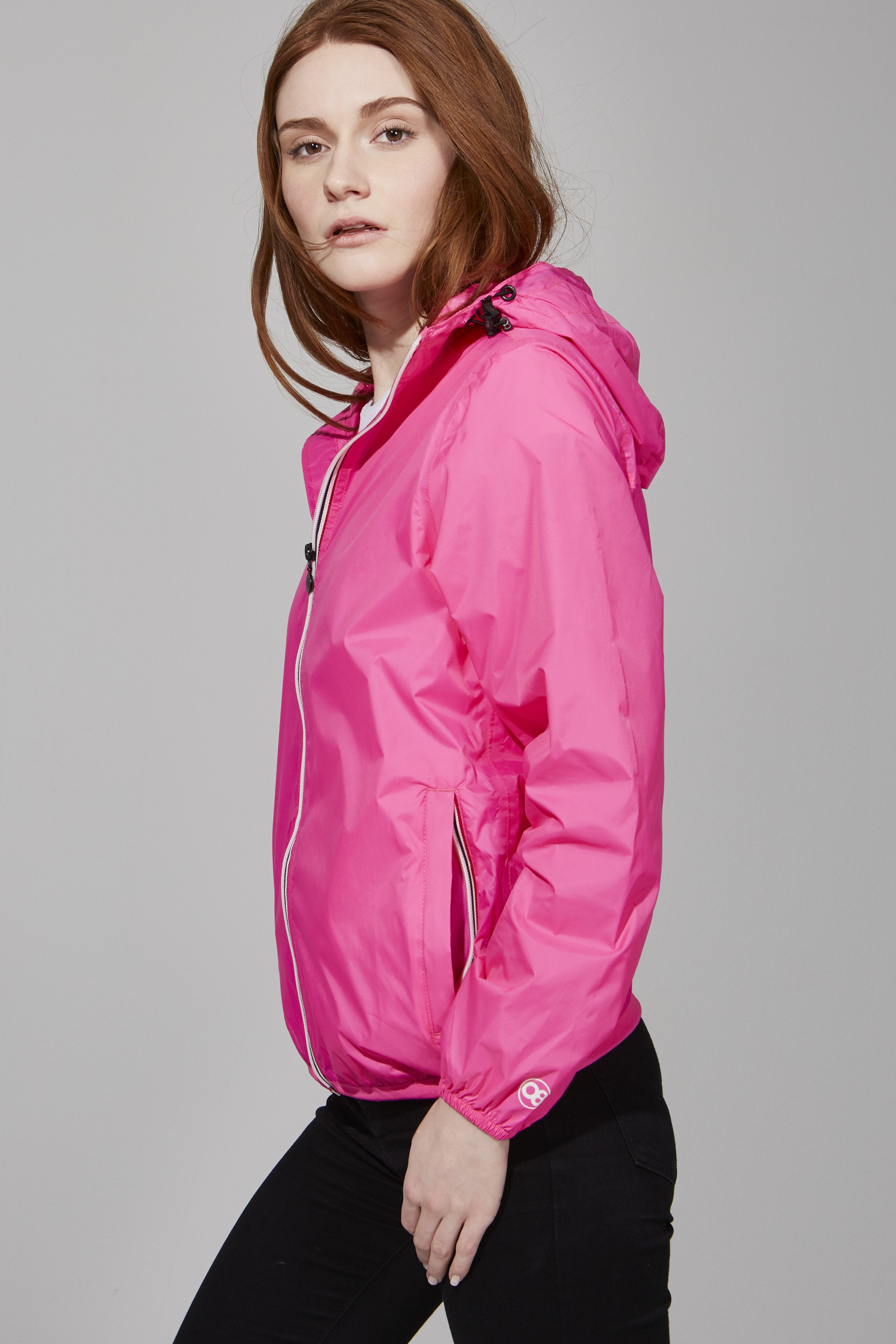 Rain jacket and windbreaker in fluorescent pink
